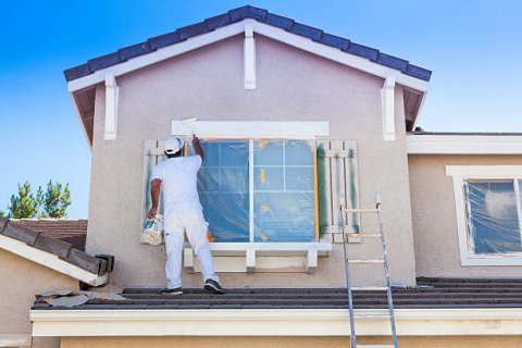 Remise en état d'une façade d'une maison à Doussard 